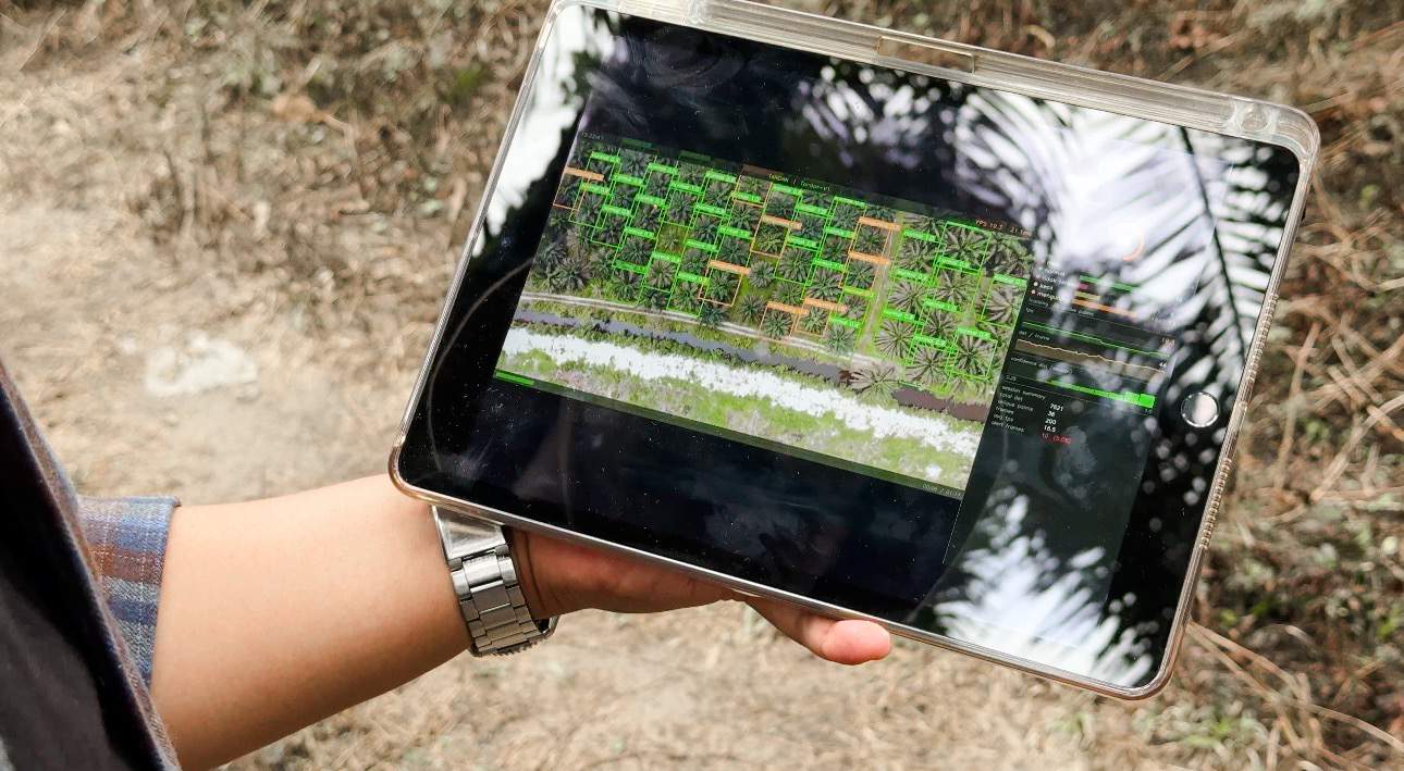 TANDAN-V1 live monitoring dashboard shown on a tablet in the field