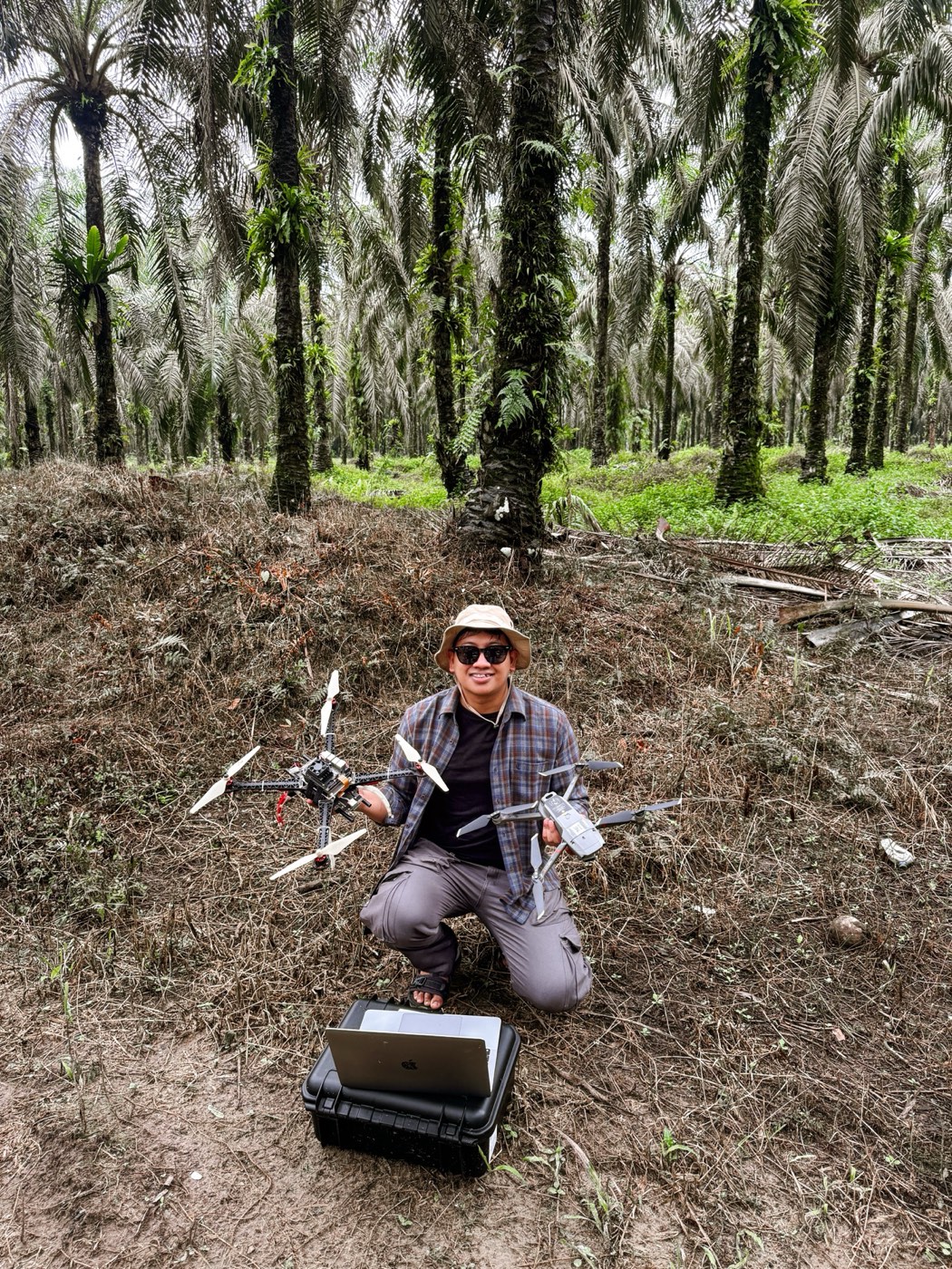 Research team during field testing, with the TANDAN drone and ground-station laptop